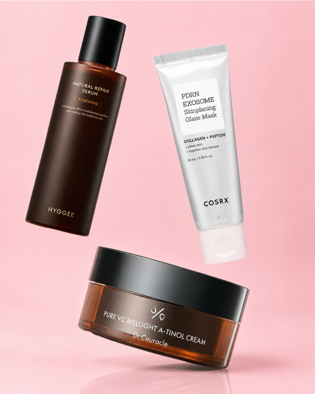 Korean skincare products for an autumn routine – Hyggee facial essence, COSRX exosome mask and Beauty of Joseon cream on a pink background