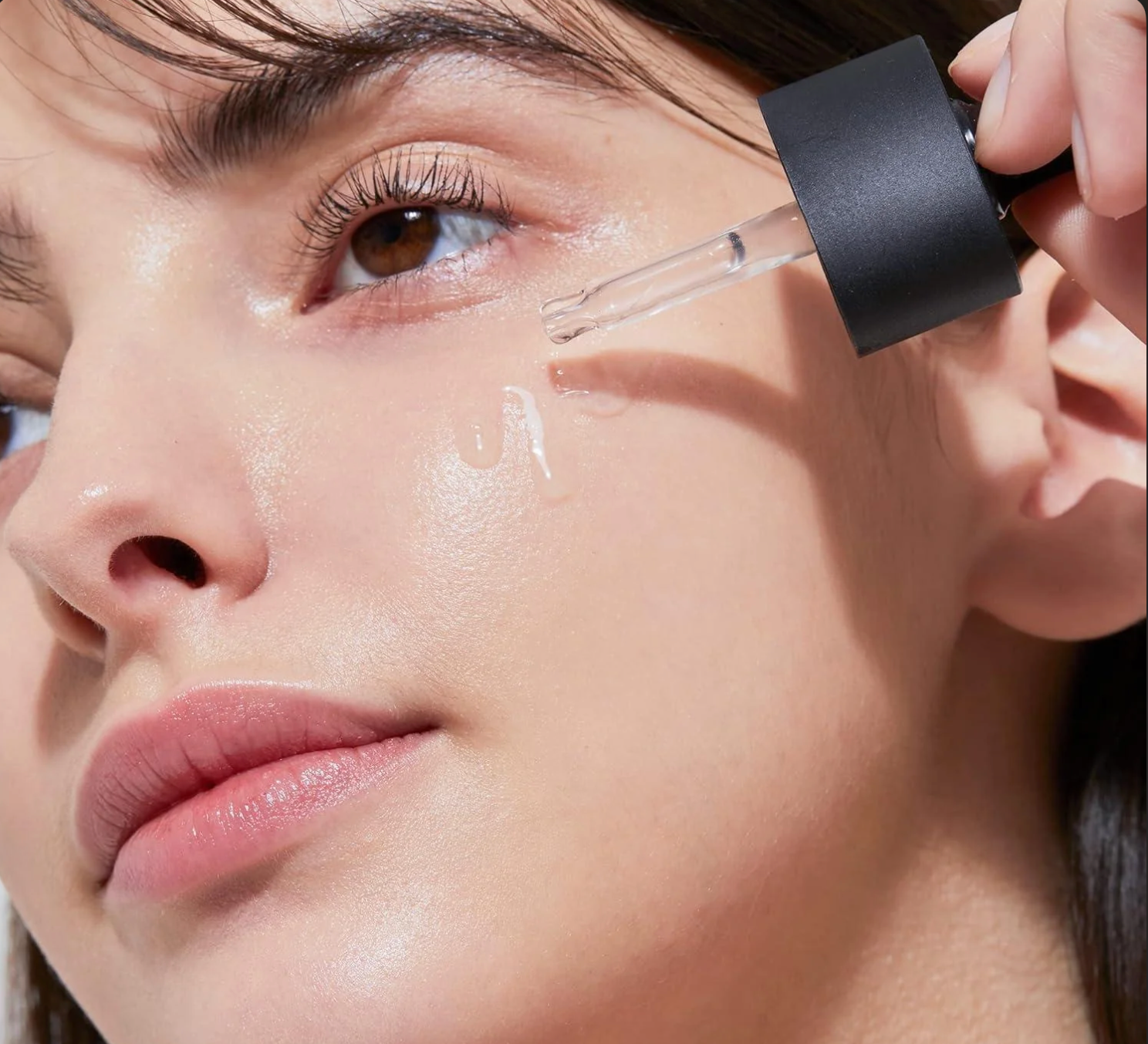 Niacinamide serum being applied to the skin in a K-beauty skincare routine for hydration, glow and improved skin texture