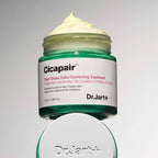 Person applying Dr.Jart+ Cicapair Tiger Grass Color Correcting Treatment on face for redness coverage