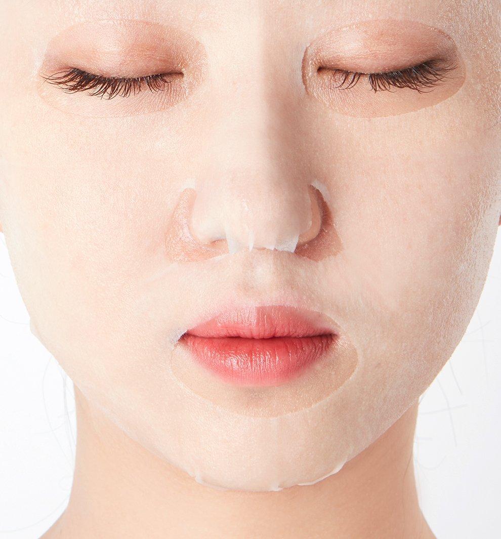 Person wearing Dr.Jart+ Dermask Brightening Solution sheet mask during skincare routine