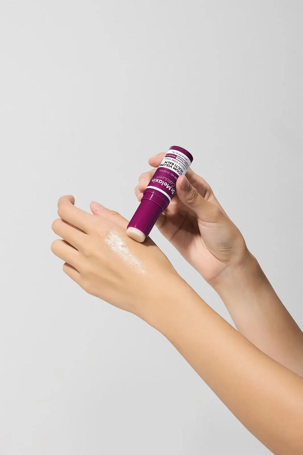 Applying Dr.Melaxin Calcium Multi Balm to dry skin