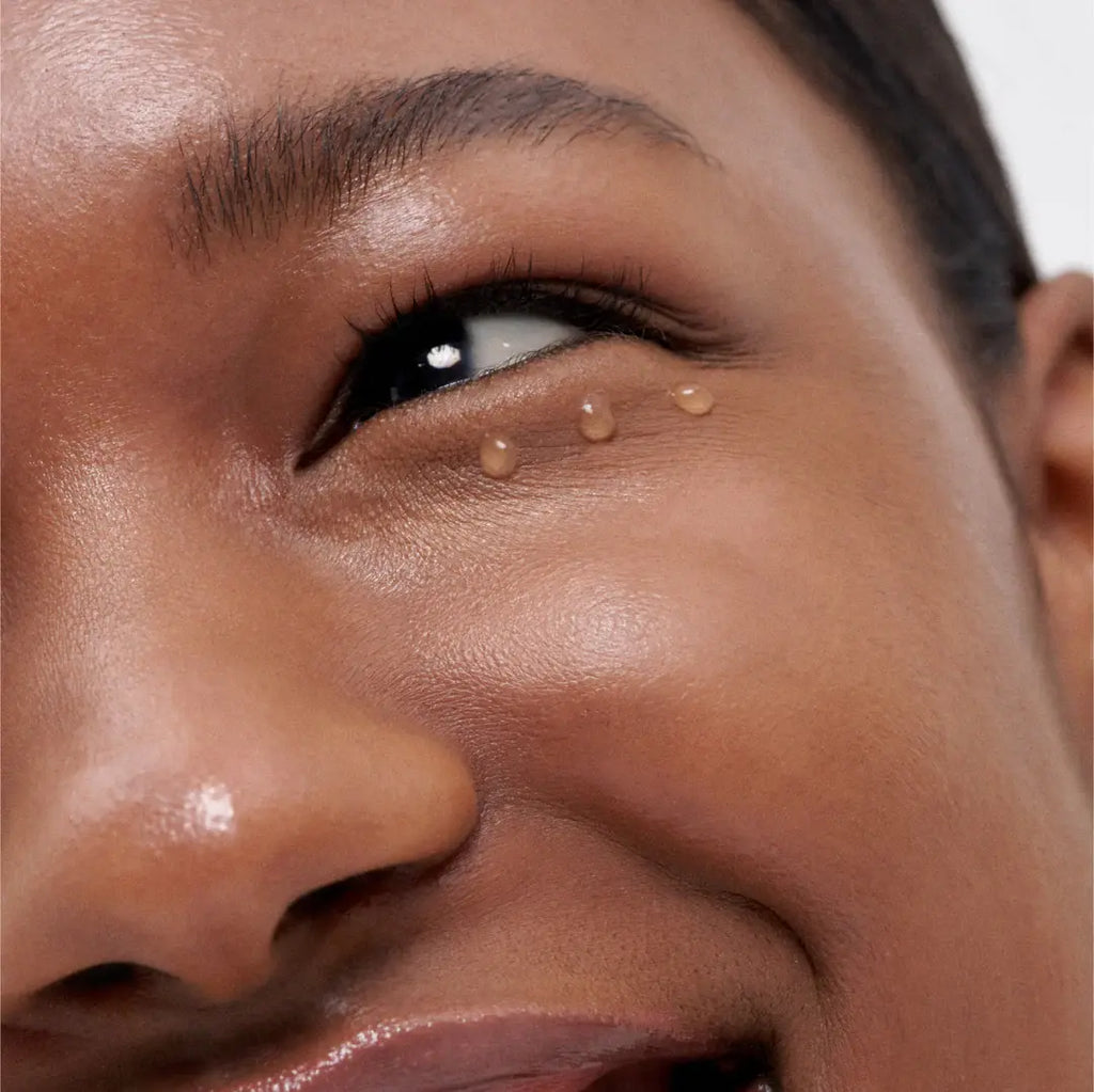 Applying Laneige Bouncy & Firm Eye Sleeping Mask under the eyes