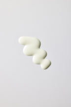 Applying PO:DL Rice PDRN sun serum on face for daily SPF protection