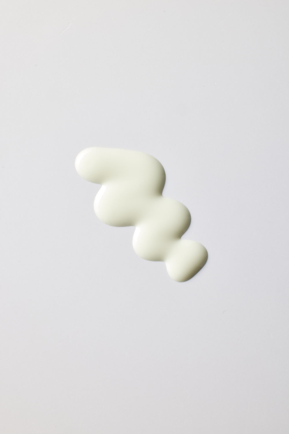 Applying PO:DL Rice PDRN sun serum on face for daily SPF protection